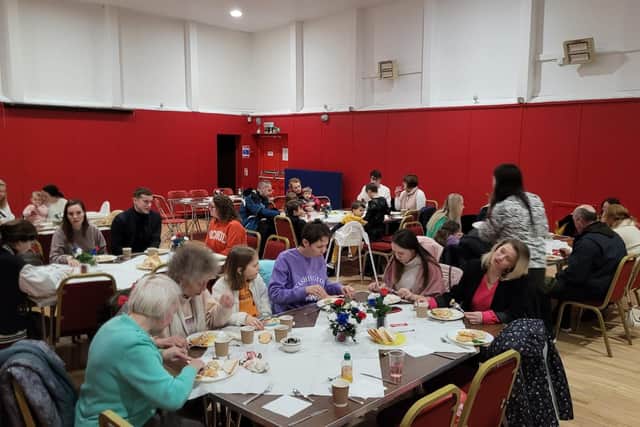 The monthly event brings Ukrainian families living in the local area together to enjoy a meal.