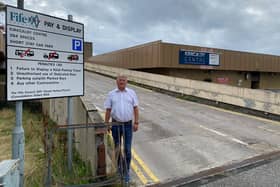 David Torrance MSP at the entrance to the car park above the closed former Postings Centre in Kirkcaldy
