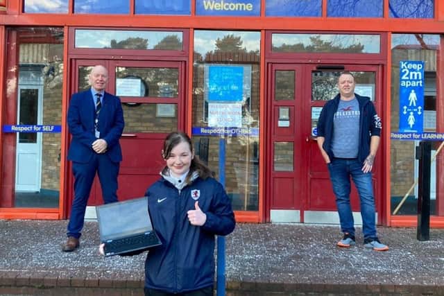 Paul Gilmour, an NHS nurse from Kirkcaldy, visited to his former school recently to donate a new laptop computer to help Kirkcaldy High School  "digital equity" during lockdown. Pictured is Derek Allan, headteacher (on the left), Paul Gilmour and this year's prizewinner Kiera Quinn (16) with the laptop.