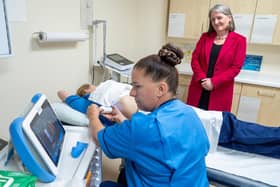 Minister for Drugs and Alcohol Policy Maree Todd watches nurse specialists Iricka King (left) and Angela Morton (centre) demonstrate a fibro scanner, which checks liver health, during a visit to Whytemans Brae Hospital in Kirkcaldy | Pix Jane Barlow/PA Media