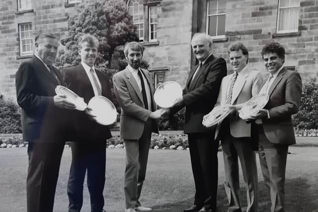 Long service awards for staff at Laidlaw (Fife) pictured in 1988  - Stewart Forrest, managing director, presents trays to (from left) Bob Taylor, Bob Good, Jock McKay, Donald Smith and Bob Christie.