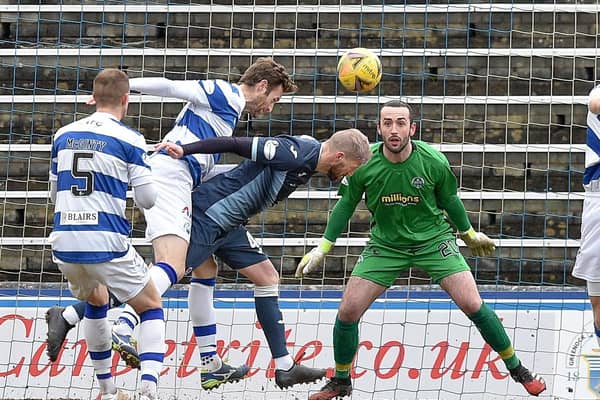 Iain Davidson heads the winning goal against Morton at Cappielow (Pic: Dave Johnston)