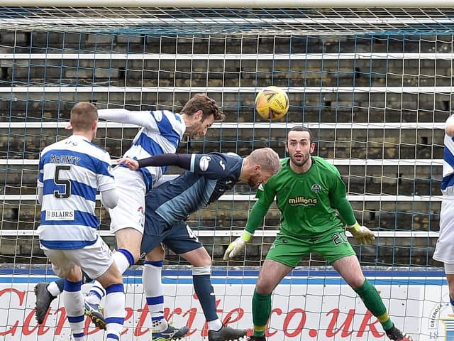 Iain Davidson heads the winning goal against Morton at Cappielow (Pic: Dave Johnston)