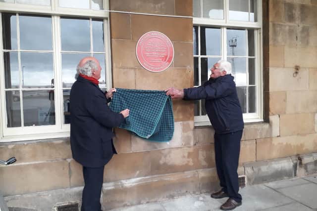 Ian Archibald (left) and John Cameron (right) unveil the prestigious award for the Fife station in Burntisland.