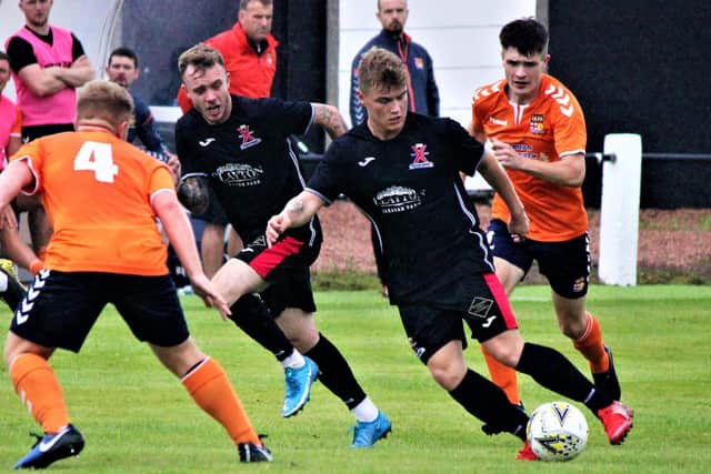 Matthew Hutchison looks to break forward for St Andrews United. Pic by John Stevenson