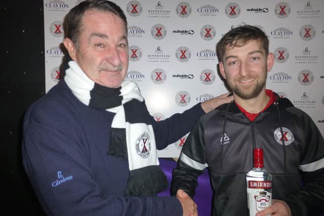 Man of the match Ryan McManus gets prize from Roy Verner