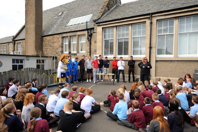 Ten years ago, Raith Rovers players and mascot Roary Rover took the  Ramsdens Cup to Kirkcaldy West Primary