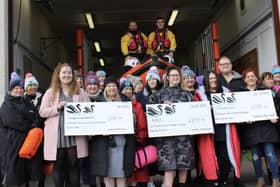 The swimmers handed over the cheques on Sunday, 26 February