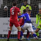 Jamie MacDonald makes one of his string of saves against Queen of the South. (Pic: Dave Johnston)