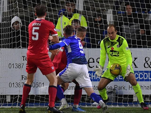 Jamie MacDonald makes one of his string of saves against Queen of the South. (Pic: Dave Johnston)