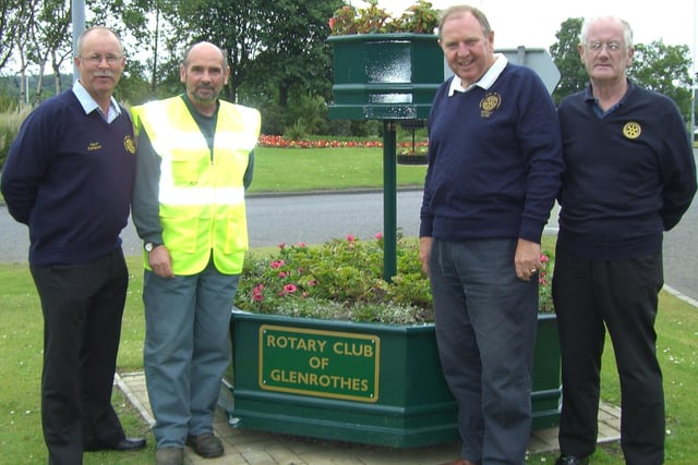 Members of Glenrothes Rotary Club with one of the community floral tubs which they have provided for the town.