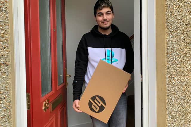 Rahaeem Akhtar, HNC Electrical Engineering student from Cowdenbeath with one of the laptops