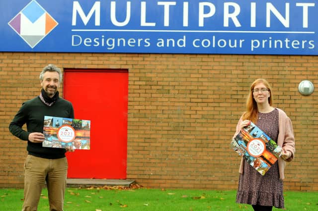 Jay Todd from Multiprint with Cara Forrester from The Cottage with the Christmas Calendars. Pic: Fife Photo Agency.