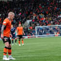 Raith Rovers' Dylan Easton confronts Dundee United's Craig Sibbald on Saturday with a packed away stand behind him (Pic by Fife Photo Agency)