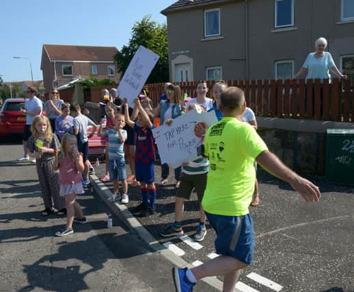 Local residents came out to show their support for the runners during the event in 2019.  Pic: George Mcluskie
