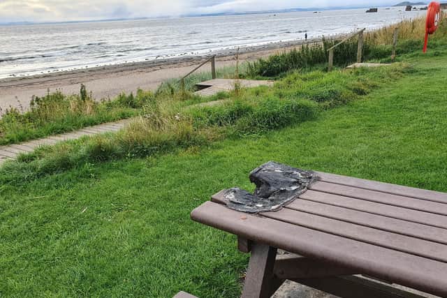 A local dog walker described the damage to the picnic tables at Seafield as the worst he had seen.