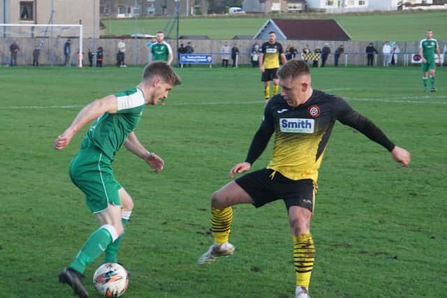 Goal hero Thomson takes on Luncarty's Keith Dewar