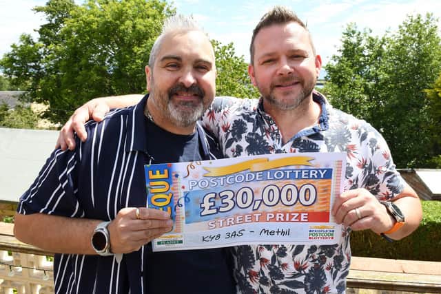 James McMillan (left) and Andrew Rogers with their cheque for £30,000.