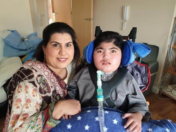 Nine-year-old Zain Adnan with his mum Asfa.