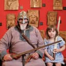 Viking reenactor Gurthrum Ormson with two of the first young visitors, siblings Jonah (6) and Darcey Dickson (4).  (Pic: OnFife/Jim Payne)