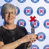 Carol Ewing with her first aid hero award (Pic: Jeff Holmes)