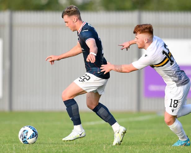 Ethan Ross of Raith Rovers eludes Dumbarton's Finlay Gray (photo by Dave Johnston/Alba Pictures)