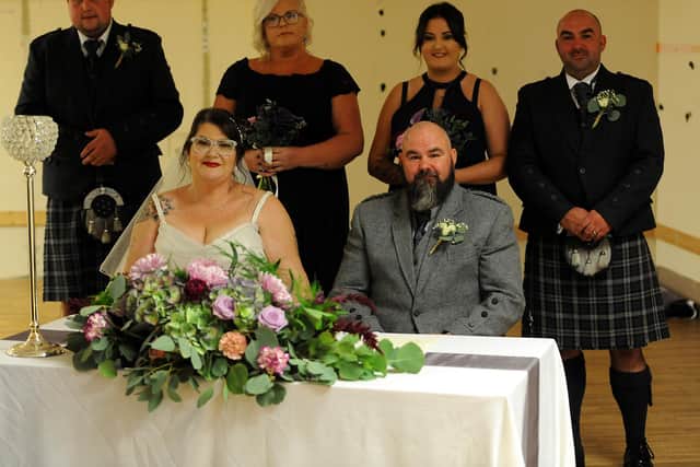 Michelle Gerrard and Stephen Meldrum, who were married in the Mercat Shopping Centre after winning the competition. They are pictured with their wedding party. Pic: Fife Photo Agency