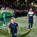 Raith's Lewis Vaughan walks out to a guard of honour alongside a mascot ahead of his own testimonial match against Hibernian (Pics by Ross Parker/SNS Group)
