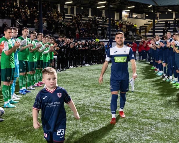 Raith's Lewis Vaughan walks out to a guard of honour alongside a mascot ahead of his own testimonial match against Hibernian (Pics by Ross Parker/SNS Group)