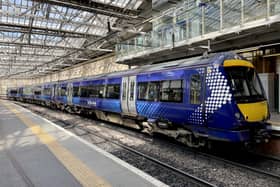 A ScotRail train waiting at the platform at Edinburgh's Waverley Station. ScotRail's new timetable, which will see almost 700 fewer train services a day across Scotland, begins today whilst the deadlock over driver pay continues. Picture date: Monday May 23, 2022.