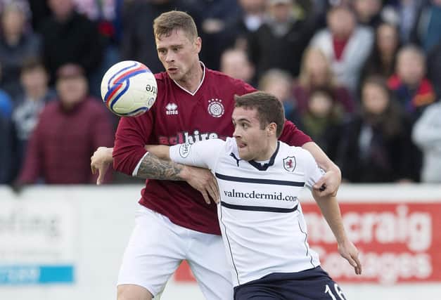 Vaughan goes up against Linlithgow Rose's John Ovenstone in November 2014 (Pic Bill Murray/SNS Group)