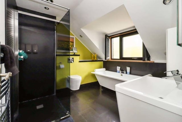 Bathroom with free standing bath and walk-in shower enclosure.
