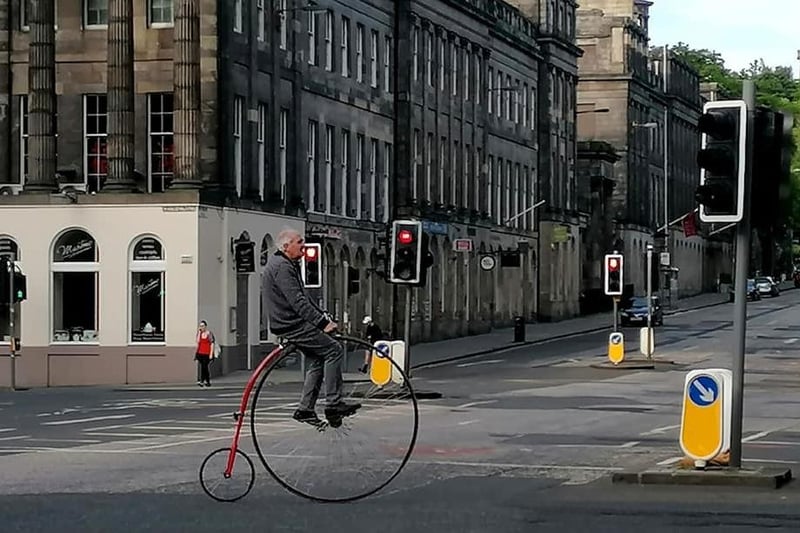 With an hour of approved exercise per day, only in Edinburgh would you spot someone on a penny farthing...