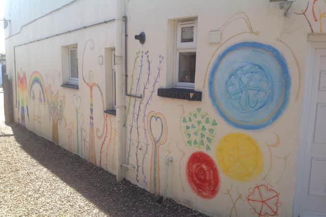 Olwen's art on the side of a house.