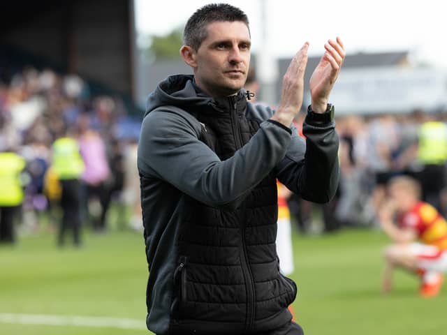Partick Thistle manager Kris Doolan applauds the fans during Premiership play-off final second leg match at Ross County (Pic by Ross Parker/SNS Group)