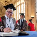 Val McDermid  signs her name in the honorary degrees book (Pic: Oxford University Images / John Cairns)