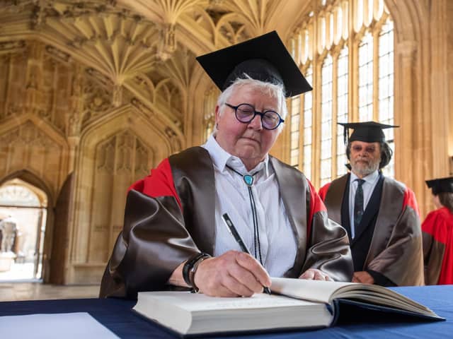 Val McDermid  signs her name in the honorary degrees book (Pic: Oxford University Images / John Cairns)