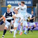 Regan Hendry challenges for the ball with Dundee's Charlie Adam (Pic: Michael Gillen)