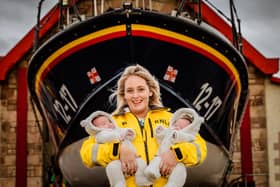 Nicole in full RNLI kit with twin baby girls Marcie and Maeve (Pic: Lynsey Melville Photography)