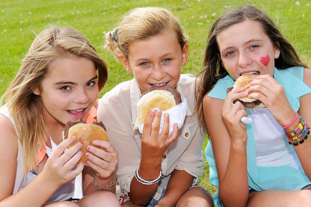Burgers all round at the school's farewell party - from left, Bailee Hunter, Tia Kelly, Jade Farmer