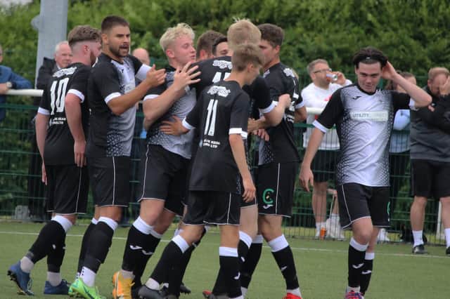 Delighted Tayport celebrate after their late winner. Pic by Ryan Masheder.