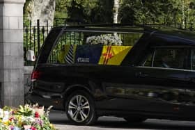 The hearse carrying the coffin of Queen Elizabeth II leaves Balmoral (Pic: PA/Owen Humphreys)