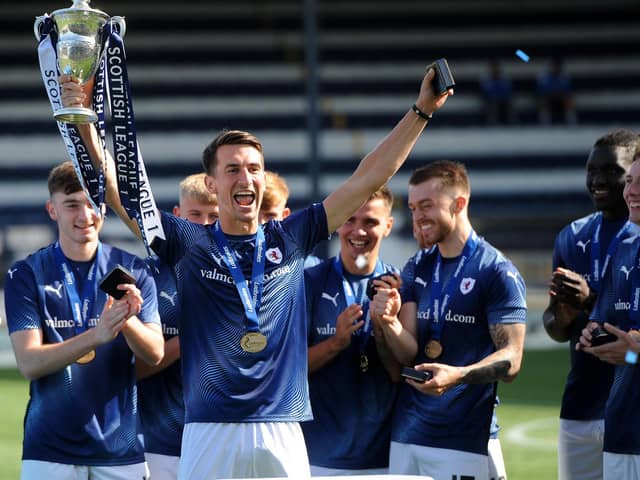 Grant Anderson celebrating winning the League 1 trophy earlier this year. Photo: Fife Photo Agency