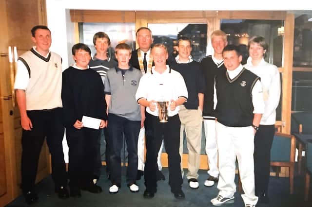 The team from St Micheals Golf Club , winners of the first ever St Andrews Rotary Junior Fours in 2001 , with President Angus Mitchell.
