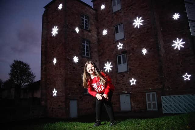 LinkLiving Christmas lights "Sponsor The Sparkle" Christmas Appeal. Eash star is sponsored by a business. Pictured is Nina Christie (9) whose Stepdad Ian Lally has sponsored one of the stars. Pic: Scott Louden.