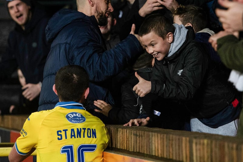 A young Raith Rovers fan gives midfielder Sam Stanton a thumbs up during the celebrations after the match