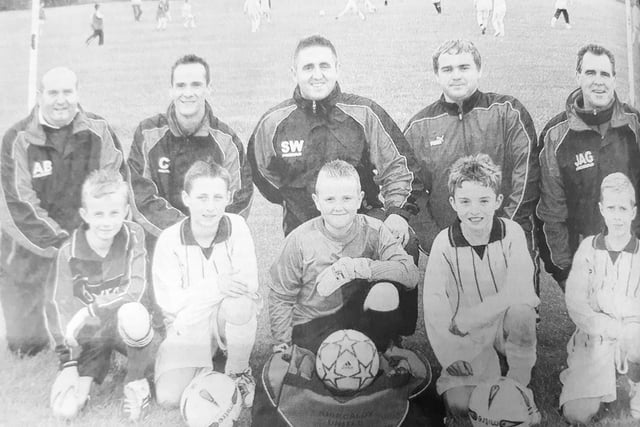 Kirkcaldy United  underlined its growing reputation with 20 players signing for senior teams over the past four years
Five captains from each age group and their representative coaches are pictured:
Alan Brown with Scott Brown (1994_); Craig Ferrie and with Ross Fraser (1995), Stephen Wilson with Daniel Garvie (1996), Robbie Liddell with Joe Kinninmouth (1997) and John Gavin with Callum Fraser (1998)