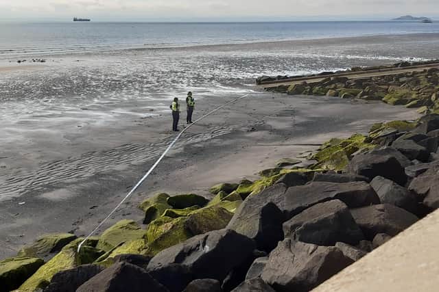Police officers cordoned off part of the beach below the seawall at Kirkcaldy
