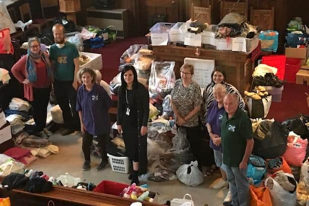 Some of the Acorn Aid team helping to sort through the masses of donations.