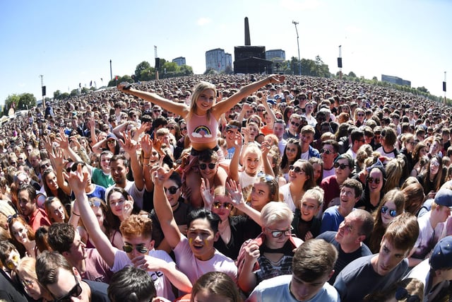 Music fans react as The Kooks perform on the main stage Photo: ANDY BUCHANAN/AFP via Getty Images)